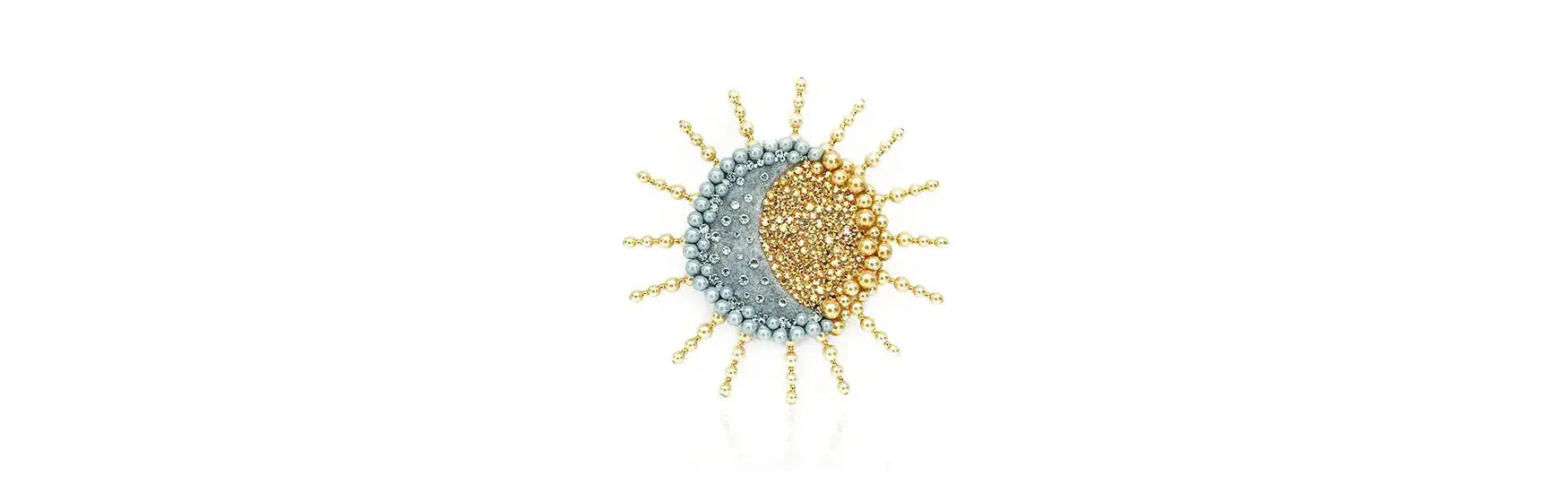 Sun and Moon motif brooch with gold Preciosa pearls and pearlescent grey pearls around the outside and Preciosa Crystals in the centre. 